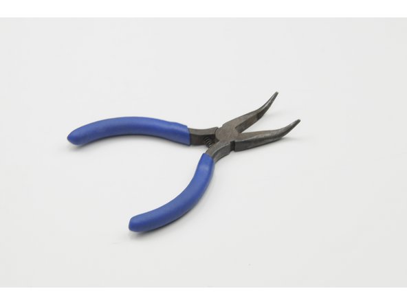 We recommend using a small set of needle nose pliers for the following steps.
