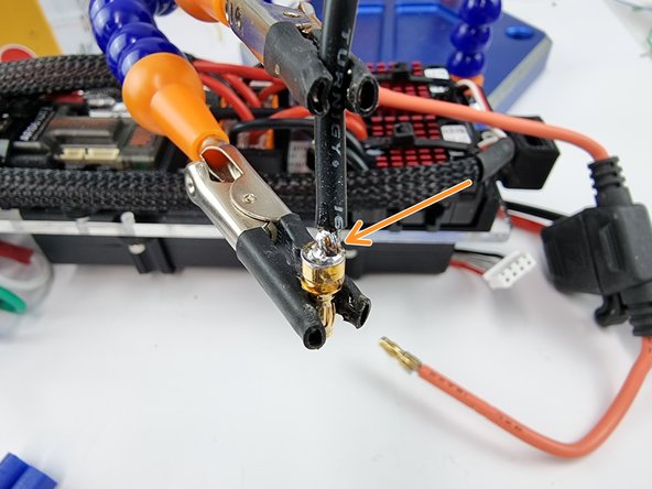 Grab the black wire that came in the kit and strip the insulation from the end of the wire.