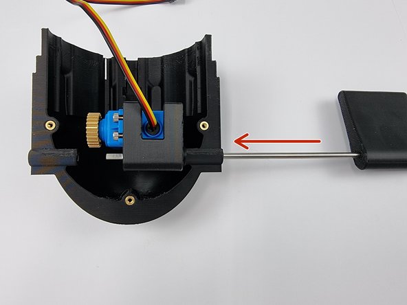 Slide the Control rod through the hold of the Bottom Fore Cap.