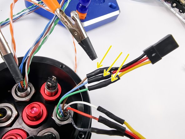 Slide the heat shrink over and apply heat to set it in place.