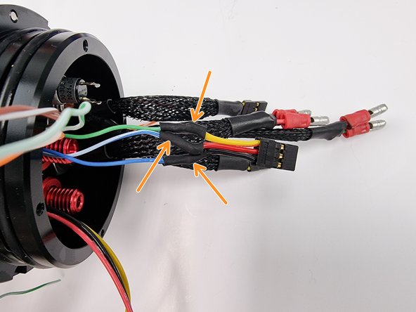 Apply heat to the heat shrink to shrink it over the soldered joint