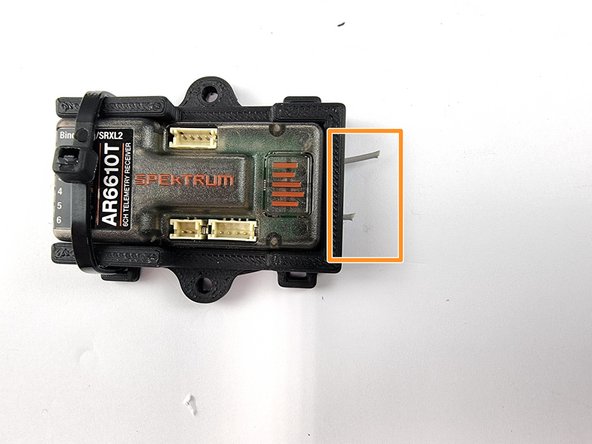 You can add a cable tie on the right side as well if you like but not required. If you do it covers the button that is used to bind the receiver with the transmitter so can make it harder to get to that button when you need it.