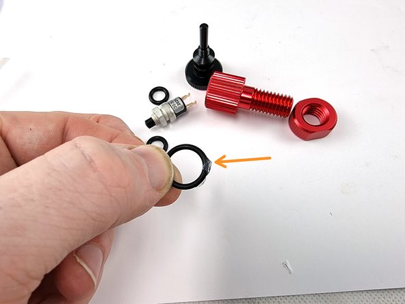 Lubricate the large O-ring with silicone grease