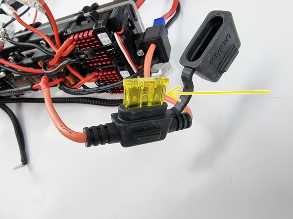 Install the 20 amp fuse into the fuse holder