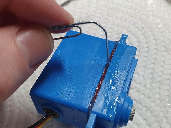 Carefully place the lid back on ensuring to keep the gears in there original position. Wipe of excess silicone grease that is pushed out as the lid is pushed on