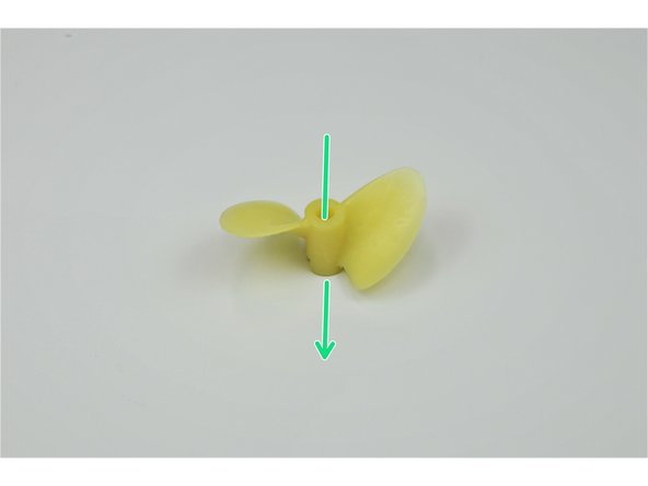 Insert the bolt through the propeller so the head of the bolt is away from the notch on the propeller.