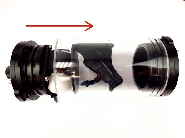 Place the bladder into the acrylic tube and slowly insert the end cap into the tube.