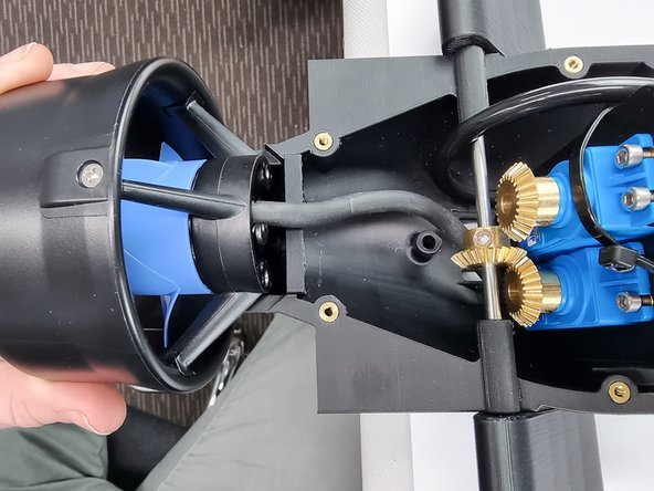 Move the thruster into position on the bottom aft cap.