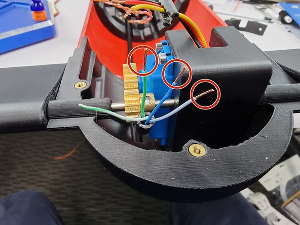 Strip the insulation from the blue, blue and white and green wires.