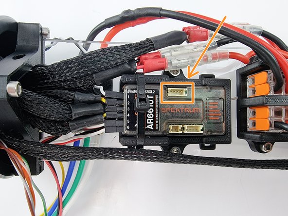 It plugs into the receiver using the top plug in the photo.