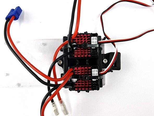 The first photo doesn't have the ESC's mounted to their mount to make it easier to see how it's mounted