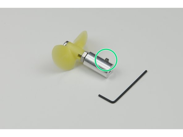 Unscrew the small set screw but do not remove it completely.