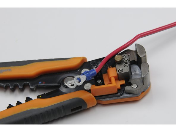 Crimp a blue ring terminal over the end of both the red wire and black wire.