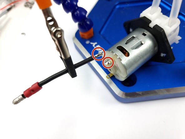 The black wire must be soldered to the side opposite the red dot.