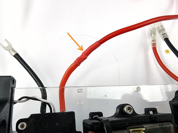 Slide the heat shrink over the soldered joint and apply heat to shrink it into place