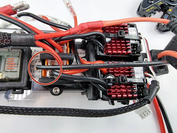 The black wire can be trimmed to length. It needs to be connected into the Wago 221 terminal block that has the other black wires in it.