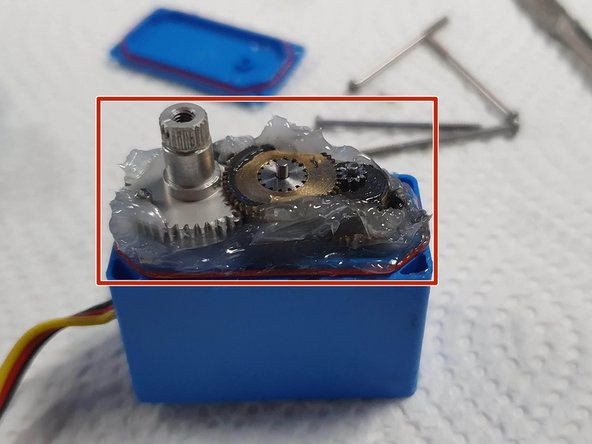 Fill under and around the gears with Silicone Grease
