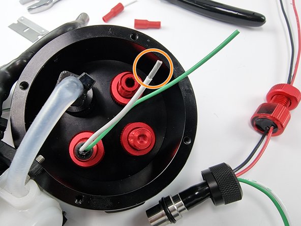 Strip the insulation from the end of the wire to prepare to install the female bullet connector.