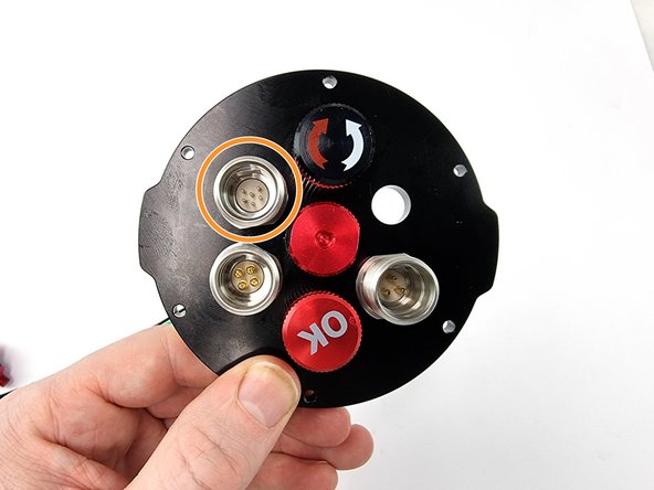 Install the 6 pin bulkhead connector in the top left hole of the end cap