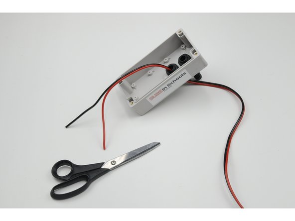 On the 30 cm of wire inside the control box, pull apart 8 cm of the red wire and black wire (separate the two joined coloured wires).