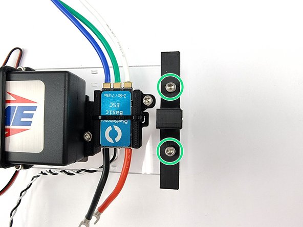 Align the holes in the mount with the threaded holes of the support plate