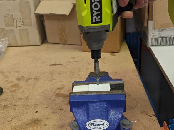 Now insert the screw into the pre-drilled hole using a drill or screwdriver.