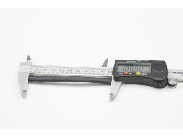 Run the wires through the hole and measure the length of wire that remains on the outside of the unit.