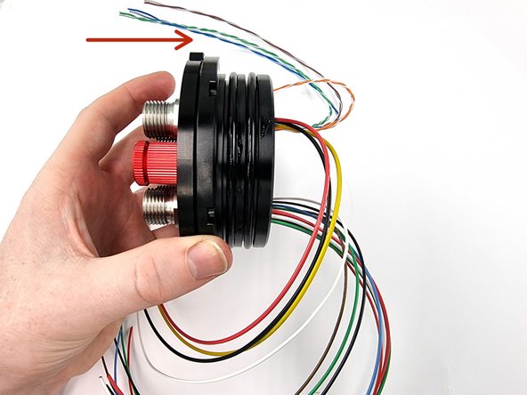 Place the end cap onto the o-ring flange. Carefully feed the wires from the bulkhead connectors through the centre of the flange