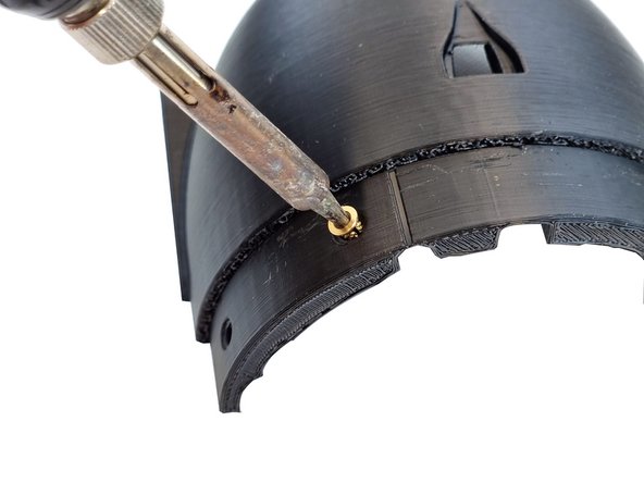 There are 4 inserts to be inserted on the bottom. These are to screw the cap to the bottom hull.