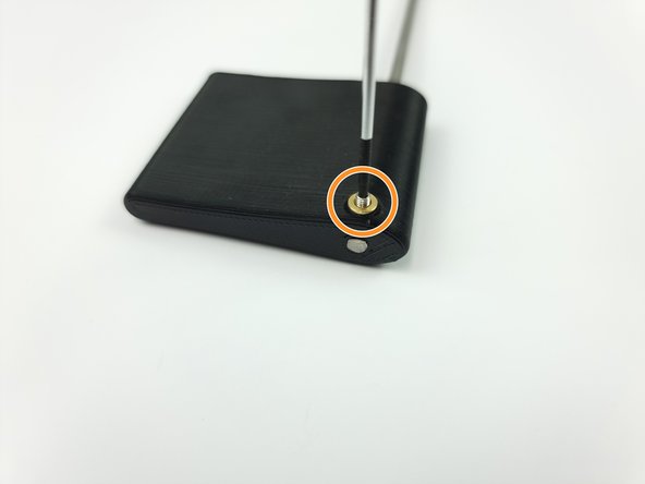 Insert an M3 set screw into the threaded insert and screw it down onto the control rod to fix it in place.