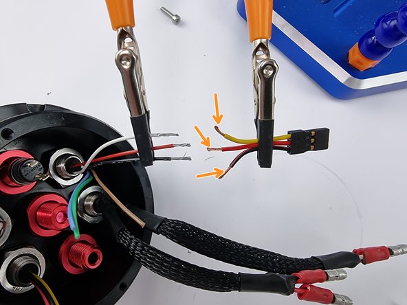 Strip the end of the wires on the connector as well. If possible it makes it easier if you can support both wires during the next steps to solder them together