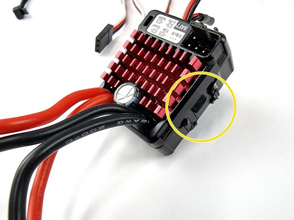 It doesn't have to be completely removed as long as the bulk of it is removed it will allow the ESC's to fit side by side in the mount.