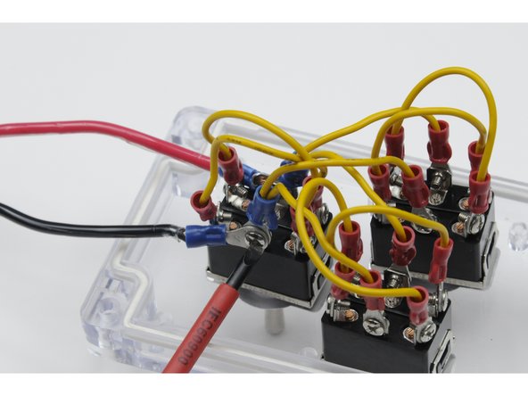 Attach both the jumper wire and the blue power wire to this post. Use the screw to secure both ring terminals and both sets of wires to the post.