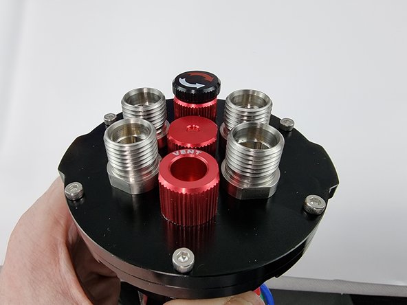 Unscrew the plug with the OK written on it. Once it unscrews pull the plug out.