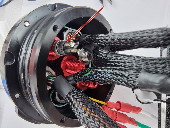 We need to solder 2 wires onto the tabs of the power switch so unscrew the switch out of the penetrator.