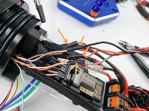 Solder the wires together with the following pairs. Brown/white soldered to black, brown soldered to maroon, orange soldered to orange and orange/white soldered to grey.