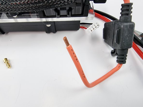 The other wire from the fuse holder is to be connected to the EC3 connector to be plugged into the battery.