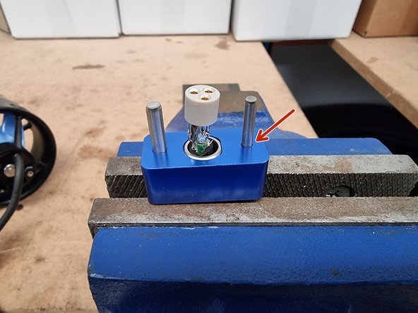 Place the lower half of the Termination Tool over the Connector Shell, aligning the flats.