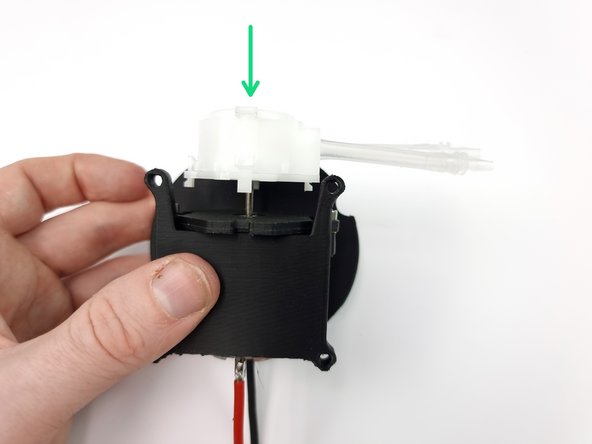 To remove head from the pump squeeze the 2 tabs on the side of the pumps in and pull the head away from the pump.