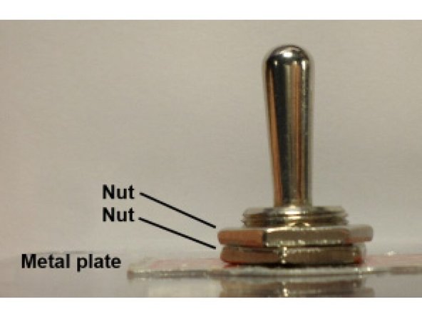 Once the orientation of the switch is correct, use pliers to tighten the nut and hold the switch securely in place.