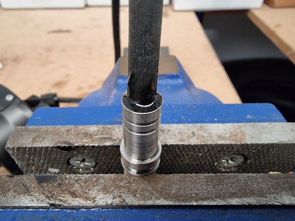 Fill the void between the cable sheath and the connector shell with the potting compound.