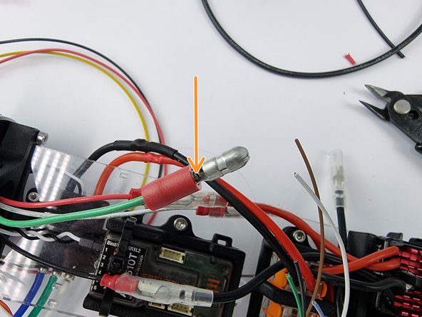 Slide a male bullet connector onto the wire. Check that it reaches all the way into the connector