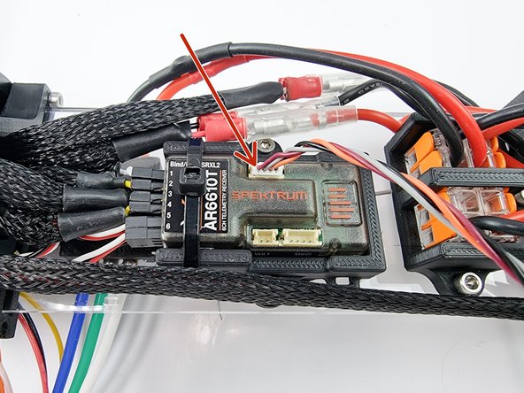 Plug the cable that comes with the satellite receiver into the port on the receiver.