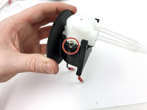 Insert 2 x M3x8mm Screws to fix the pump to the mount