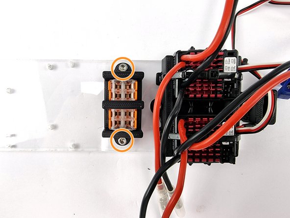 Place the mount with connectors inserted onto the support plate next to the ESC mount