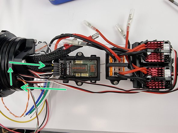 Rather then cutting the cables shorter you can direct them around the support plate mount to use up the extra length.
