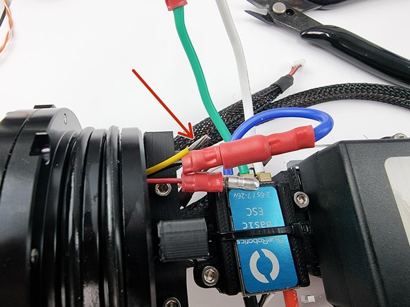 Trim the yellow wire to length and strip the insulation from the end of the wire.