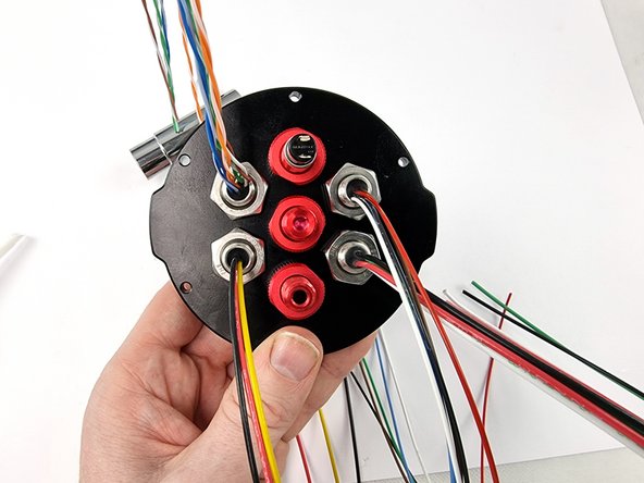 Install the nut on the back side of the bulkhead connector and tighten with the penetrator wrench and a 17mm spanner