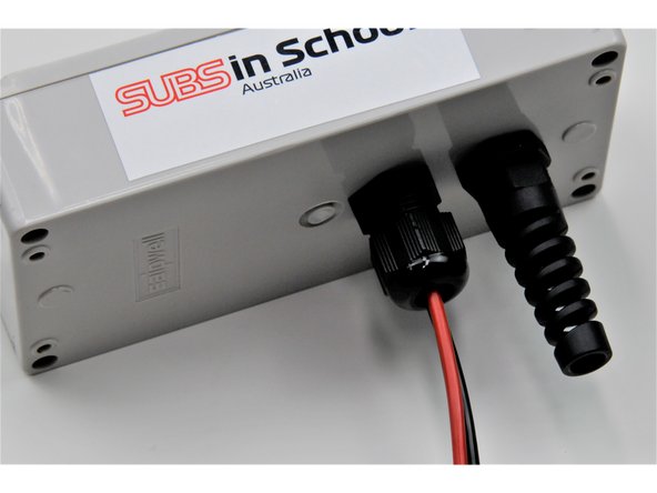 Once both the red and black wire are secured to a switch, pull the any excess power wire back out through the small stress relief. Tighten the small stress relief nut over the threads to secure the power wire in place.