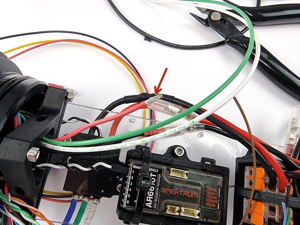 Cut the red wire to length allowing for the bullet connector to be crimped onto the end of the wire